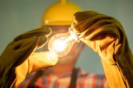 light light bulb in man's hands